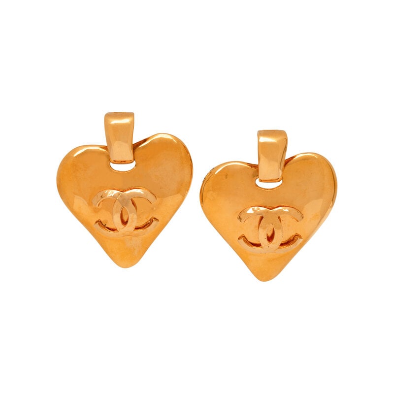 Chanel, CC Heart Ear Clips, 1993: Chanel, CC Heart Ear Clips, 1993 Pair of hanging heart-shaped & CC ear clips in gold-tone metal. Standard ear clip backs. Stamped with maker's marks at back. Label: Chanel Date: S/S 1993