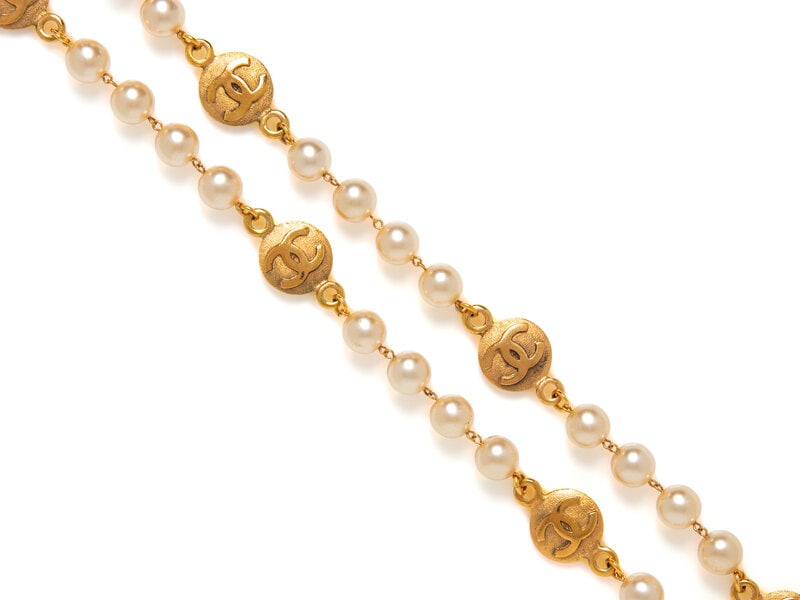 Chanel, CC Coin & Gripoix Pearl Necklace: Chanel, CC Coin & Gripoix Pearl Necklace Necklace in gold-tone metal with CC coin and Gripoix pearl beads. Spring-loaded clasp closure. Unmarked. Label: Unmarked, attributed to Chanel Date: