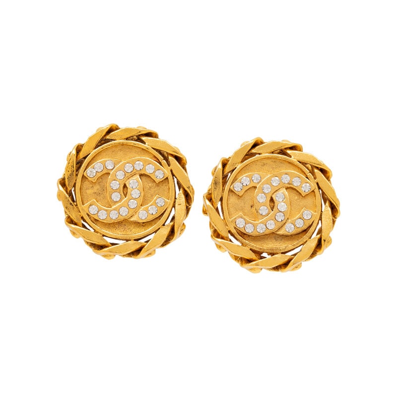 Chanel, Rhinestone-Studded CC Ear Clips: Chanel, Rhinestone-Studded CC Ear Clips Pair of circular ear clips in gold-tone metal with rhinestone-studded CC logos. Standard ear clip backs. Stamped with maker's marks at back. Label: Chanel