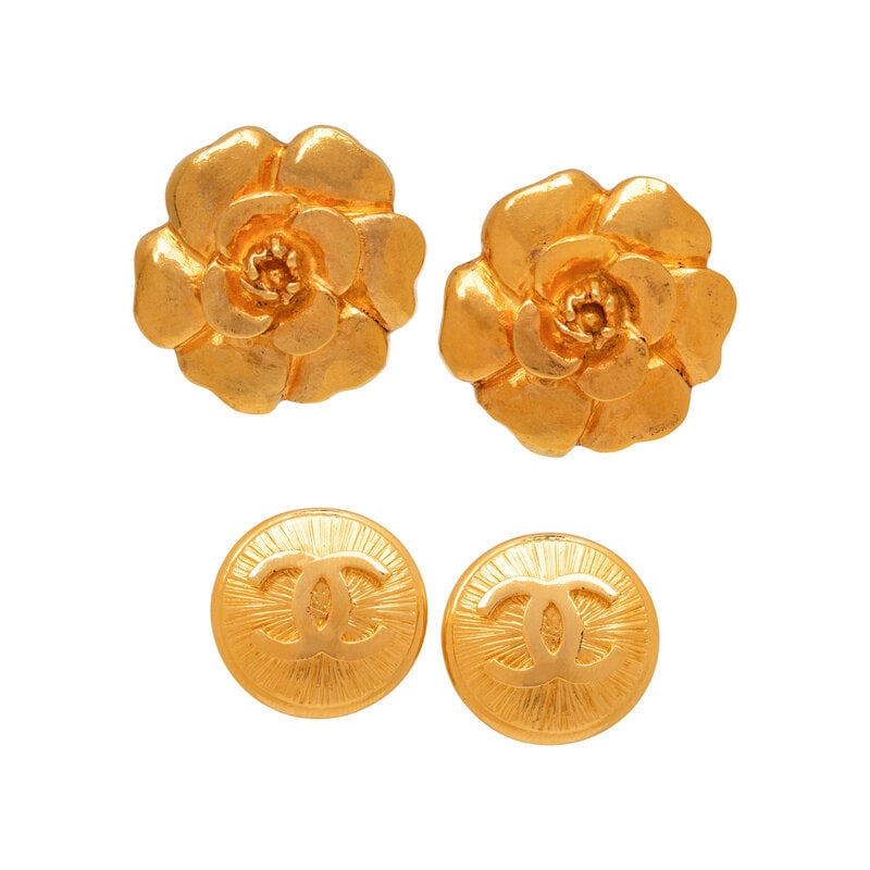 Chanel, Two Pairs of Ear Clips: Chanel, Two Pairs of Ear Clips THE FIRSTPair of camellia-shaped ear clips in gold-tone metal. Standard ear clip backs. Stamped with maker's marks at back.Label: Chanel