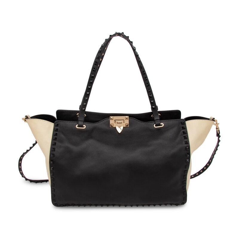 Valentino, Black & White Medium Rockstud Tote: Valentino, Black & White Medium Rockstud Tote Medium Vitello Rockstud Tote bag in black and cream leather with black Rockstud embellishments and gold-tone hardware. Latch closure,