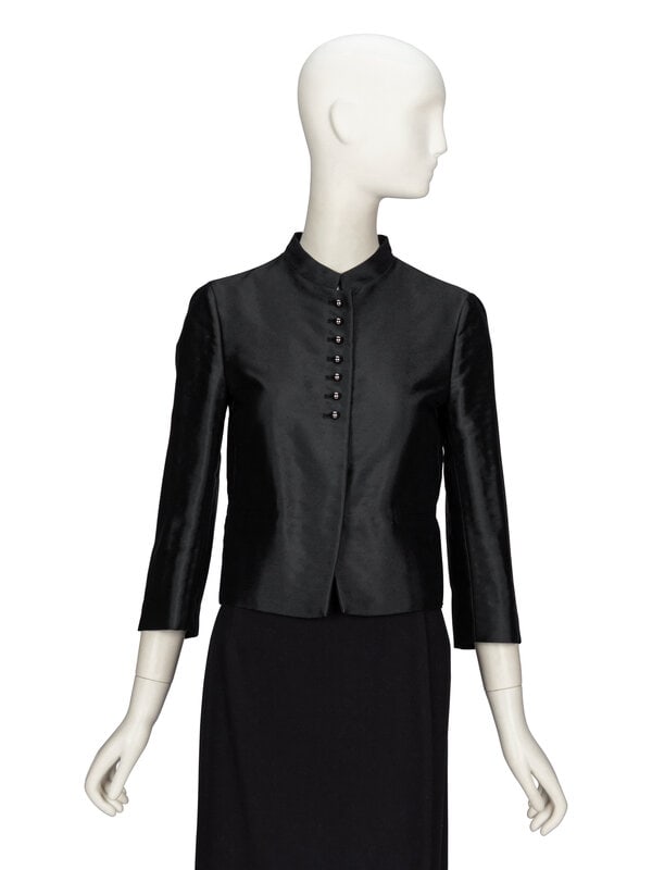 Valentino, Black Evening Jacket: Valentino, Black Evening Jacket Cropped & fitted evening jacket in glossy wool-blend twill. Short stand collar. Three-quarter-length set-in sleeves with decorative buttons at sleeve hems. Two