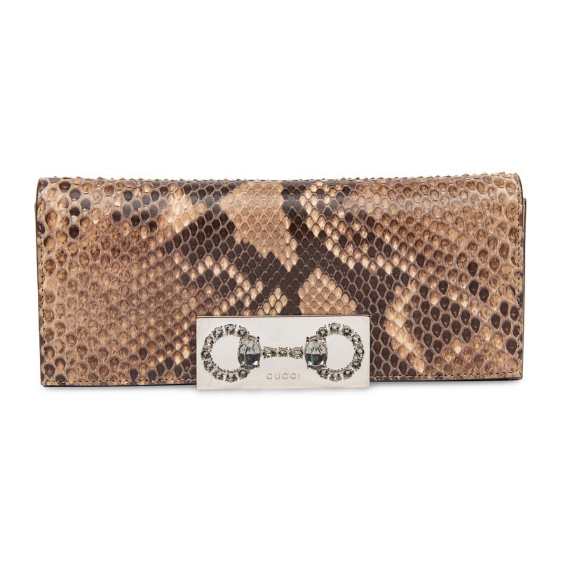 Gucci, Python Clutch: Gucci, Python Clutch Clutch in natural Python snakeskin with silver-tone hardware and a rhinestone horsebit detail. Magnetic snap closure to flap. Label: Gucci Style/Serial No.: 371927 204990