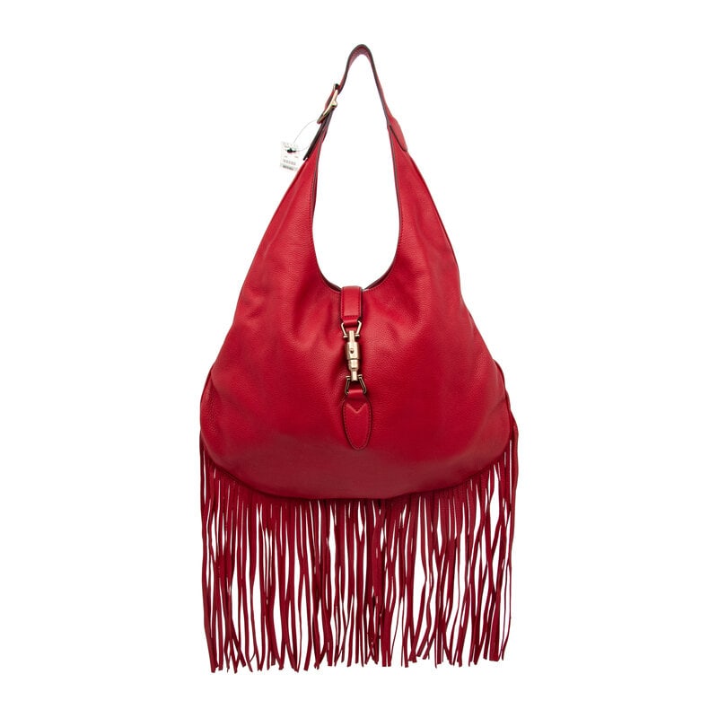 Gucci, Fringed Leather Jackie Hobo Bag: Gucci, Fringed Leather Jackie Hobo Bag Noveau Jackie hobo bag in grained red calfskin leather with fringe trim at base of bag. Piston-lock closure and adjustable flat leather handle. Label: Gucci