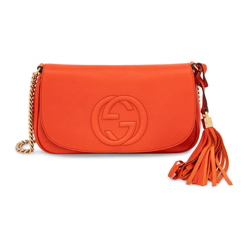 Gucci, Orange Leather Soho Flap Bag: Gucci, Orange Leather Soho Flap Bag Soho flap bag in grained orange calfskin leather. Magnetic snap closure and retractable metal chain shoulder strap. Label: Gucci Style/Serial No.: 336752 213317