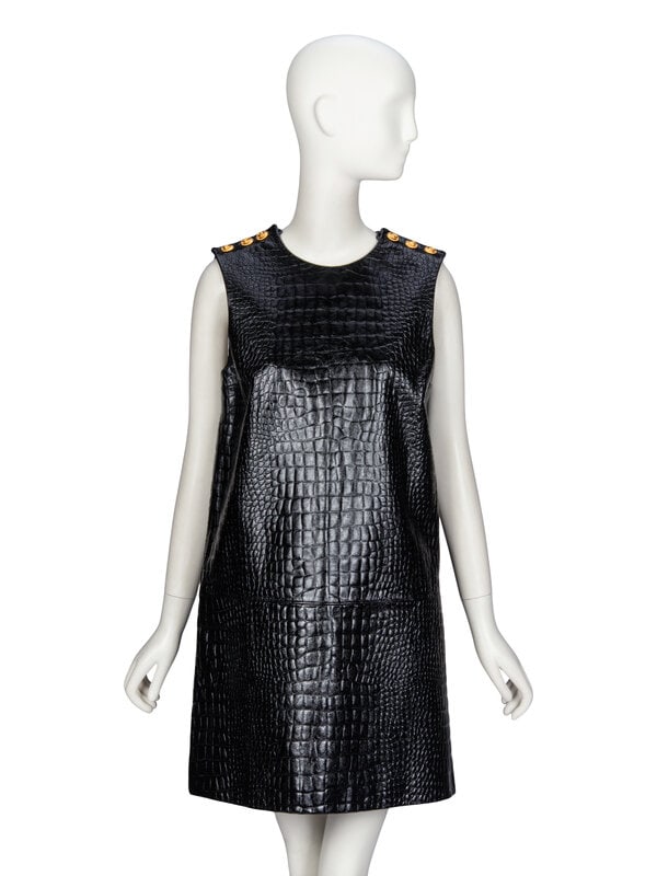 Gucci, Croc-Effect Leather Dress: Gucci, Croc-Effect Leather Dress Sleeveless shift dress in croc-embossed glossy black calfskin leather. Knee-length; slight A-line silhouette. Round collarless neckline. Functional button closures