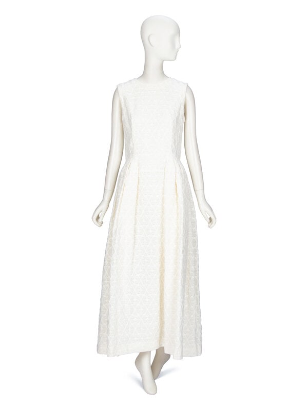 Alexander McQueen, White Jacquard Gown: Alexander McQueen, White Jacquard Gown Sleeveless gown in ivory matelassé/jacquard textile. Round collarless neckline. Fitted bodice. Full-length skirt with pleats at side waist & at back