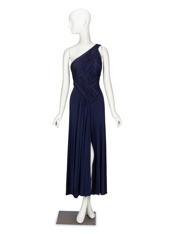 Scaasi, Navy Pleated Dress: Scaasi, Navy Pleated Dress Evening dress in navy blue finely draped & pleated silk jersey. Asymmetric one-shoulder neckline. Light boning in bodice; asymmetrically draped & pleated