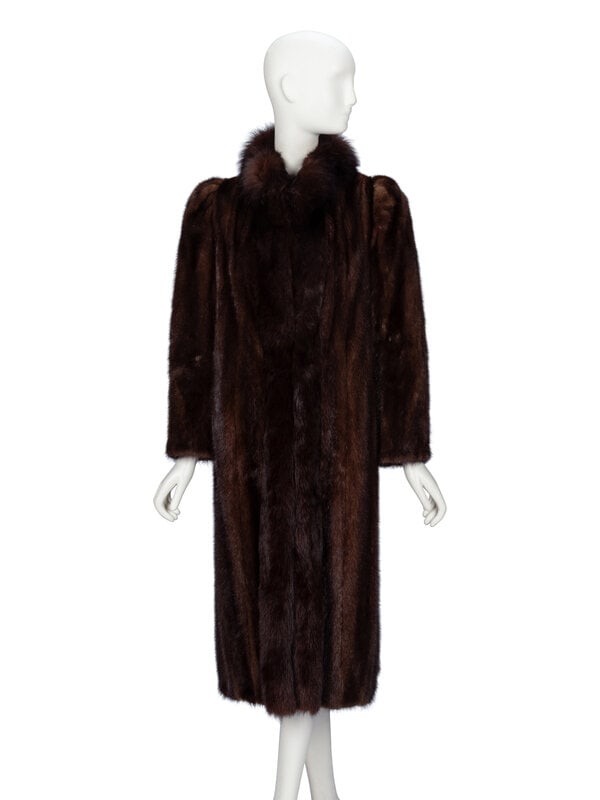 Marshall Fields, Mink & Fox Fur Coat: Marshall Fields, Mink & Fox Fur Coat Mid-calf length coat in brown mink fur with brown fox fur trim. Stand collar. Full-length sleeves with puffed shoulders. Two slit pockets at front;