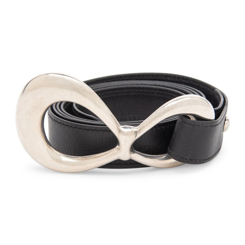 Elsa Peretti, Tiffany & Co,; Infinity Buckle & Black Leather Belt : Elsa Peretti, Tiffany & Co,; Infinity Buckle & Black Leather Belt Belt in black calfskin leather with sterling silver 'Infinity' buckle. Buckle features "Naples, May 19, 2002" engraving at