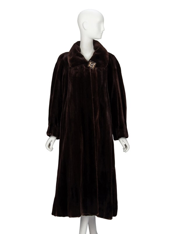 Maximilian, Brown Sheared Mink Coat: Maximilian, Brown Sheared Mink Coat Mid-calf length A-line coat in brown sheared mink fur. Rounded spread collar. Full-length raglan sleeves. Two slit pockets at front; one interior breast