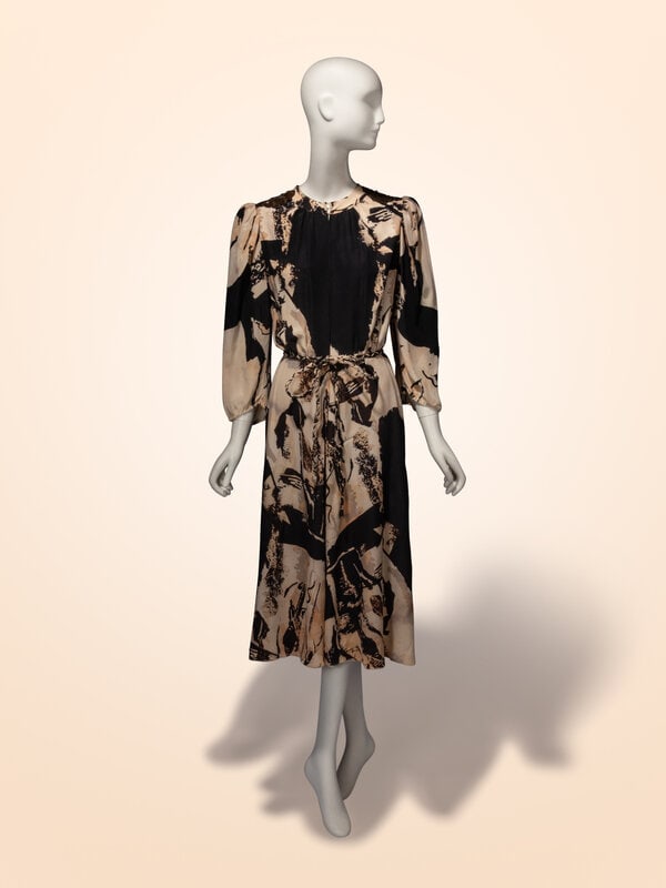 Thea Porter, Abstract Printed Silk Dress: Thea Porter, Abstract Printed Silk Dress Dress in a beige & black abstract-printed silk crêpe de chine. Flat band collar. Sequin & bead embellished patches at shoulders. Gathering