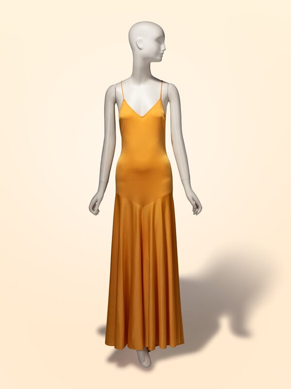 Loris Azzaro Haute Couture, Goldenrod Yellow Jersey Gown: Loris Azzaro Haute Couture, Goldenrod Yellow Jersey Gown Sleeveless gown in goldenrod yellow poly jersey. V-shaped neckline; lower-cut at back. Self-fabric straps with crossover at back. Drop waist
