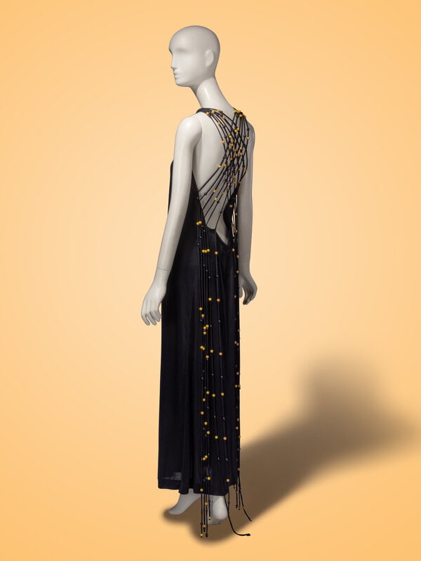 Exceptional Loris Azzaro Haute Couture, Black Halter Gown with Beads, 1971: Exceptional Loris Azzaro Haute Couture, Black Halter Gown with Beads, 1971 Halter gown in black poly jersey knit. Halter neck front; very deeply cut back neckline. Corded collar with black