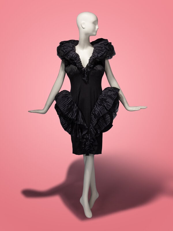 Attributed to Loris Azzaro Haute Couture, Structured Black Dress: Attributed to Loris Azzaro Haute Couture, Structured Black Dress Cocktail sheath dress in black satin with pleated black charmeuse and tulle accents. V neckline with structured tulle & pleated