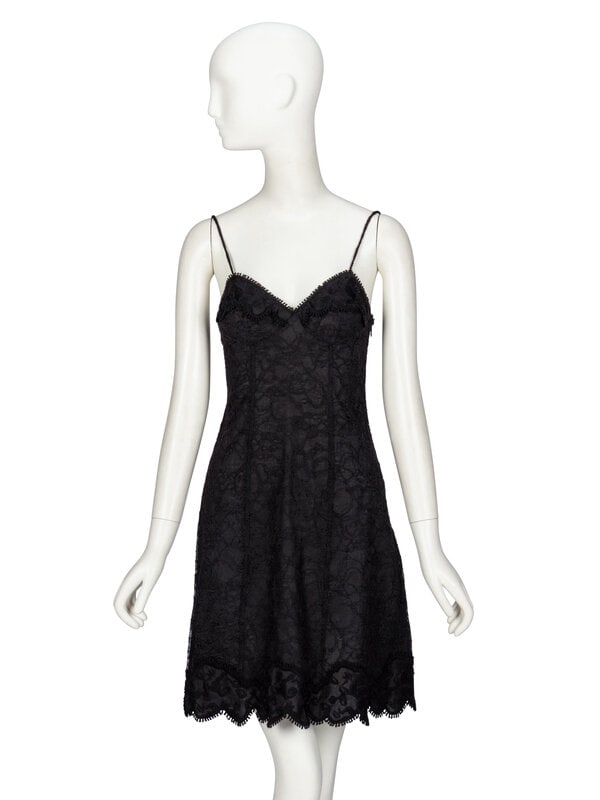Rochas, Black Lace Slip Dress: Rochas, Black Lace Slip Dress Slip dress in black cotton-blend lace. Sweetheart neckline with spaghetti straps. Slightly flared silhouette. Mid-thigh length skirt with scalloped hem. Invisible