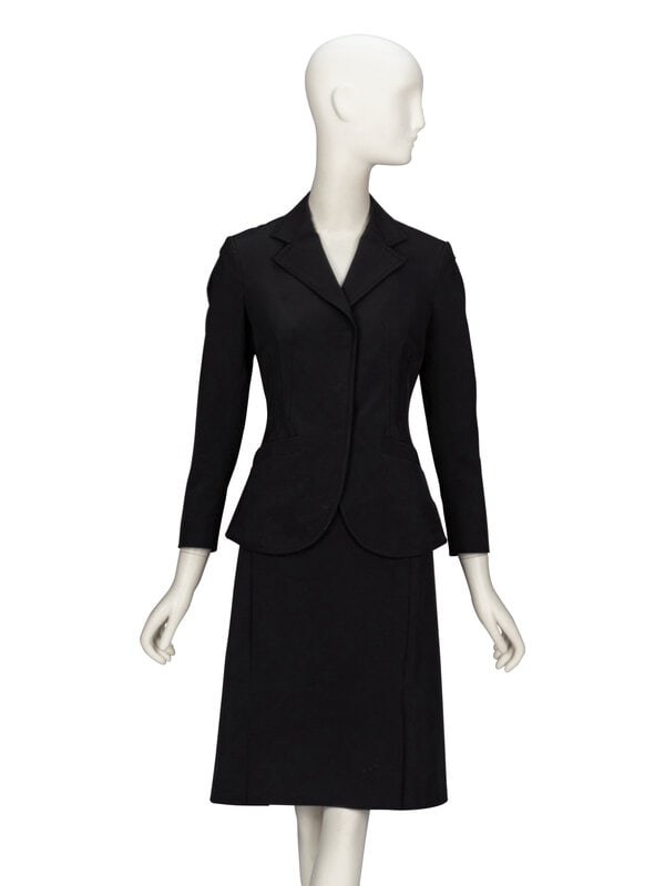 Prada, Black Twill Skirt Suit: Prada, Black Twill Skirt Suit THE FIRST Fitted suit jacket in black polyester/elastane-blend twill. Decorative topstitching throughout. Notched lapels. Wrist-length set-in sleeves with concealed