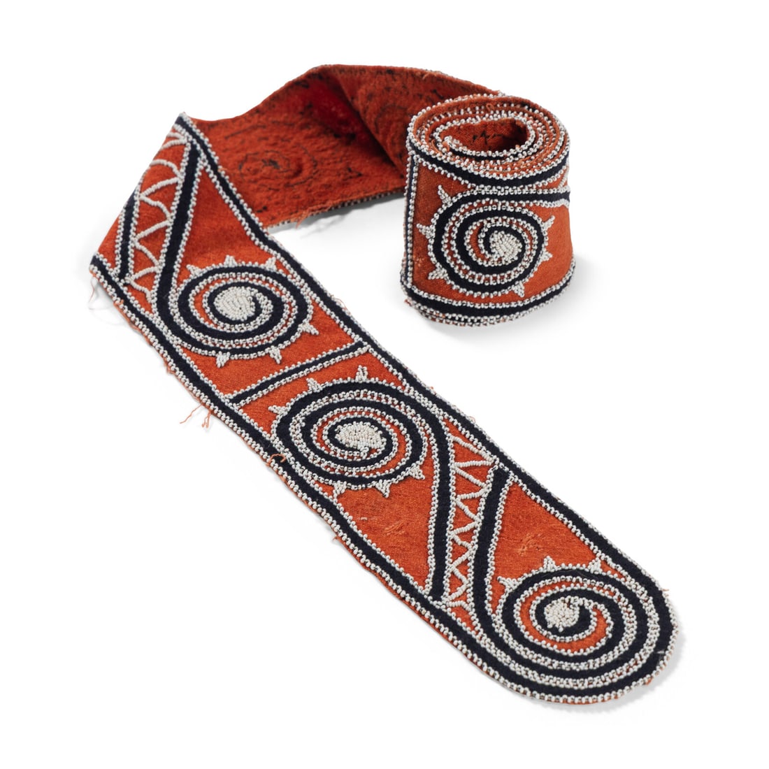 Choctaw Beaded Wool Sash: Choctaw Beaded Wool Sash third quarter 19th century red and navy wool with classic scroll design in white glass beads length 69 inches x width 4 inches This lot is located in Chicago.