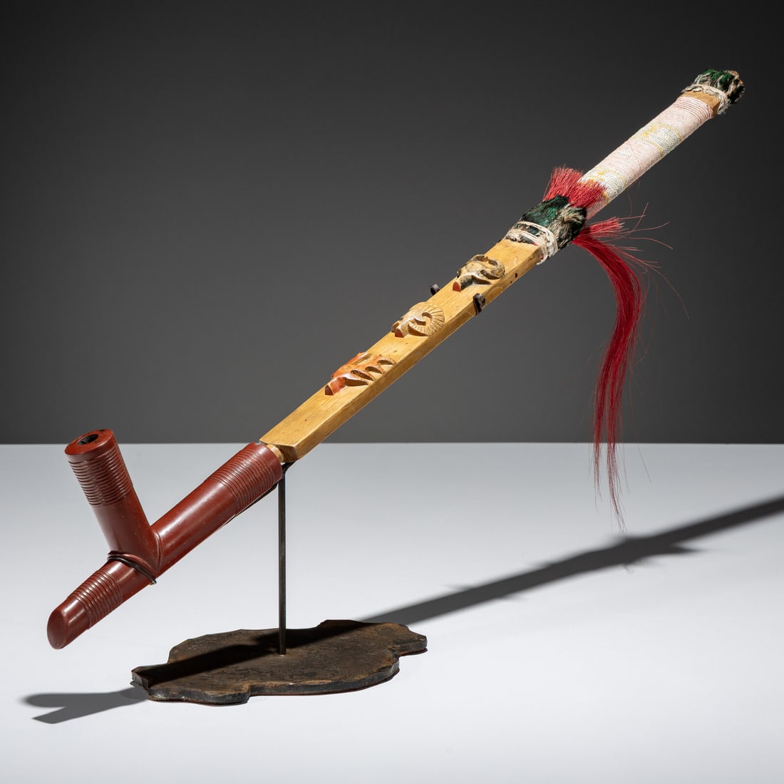 Standing Rock Sioux Pipe, with Catlinite Bowl: Standing Rock Sioux Pipe, with Catlinite Bowl ca 1900 the stem features a buffalo, ram, and elk head carved in relief; further embellished with quilled wrapping; T-shaped catlinite bowl carved with