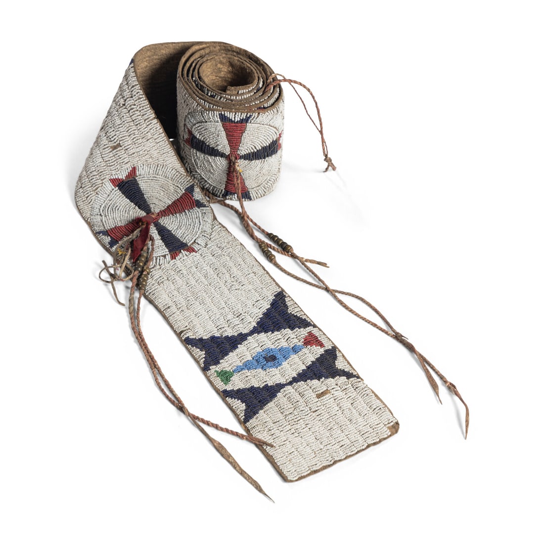 Sioux Beaded Buffalo Hide Blanket Strip: Sioux Beaded Buffalo Hide Blanket Strip fourth quarter 19th century sinew-sewn and beaded with colors of cobalt, red white-heart, light blue, pea green, and white; twisted hide tassels with brass bead