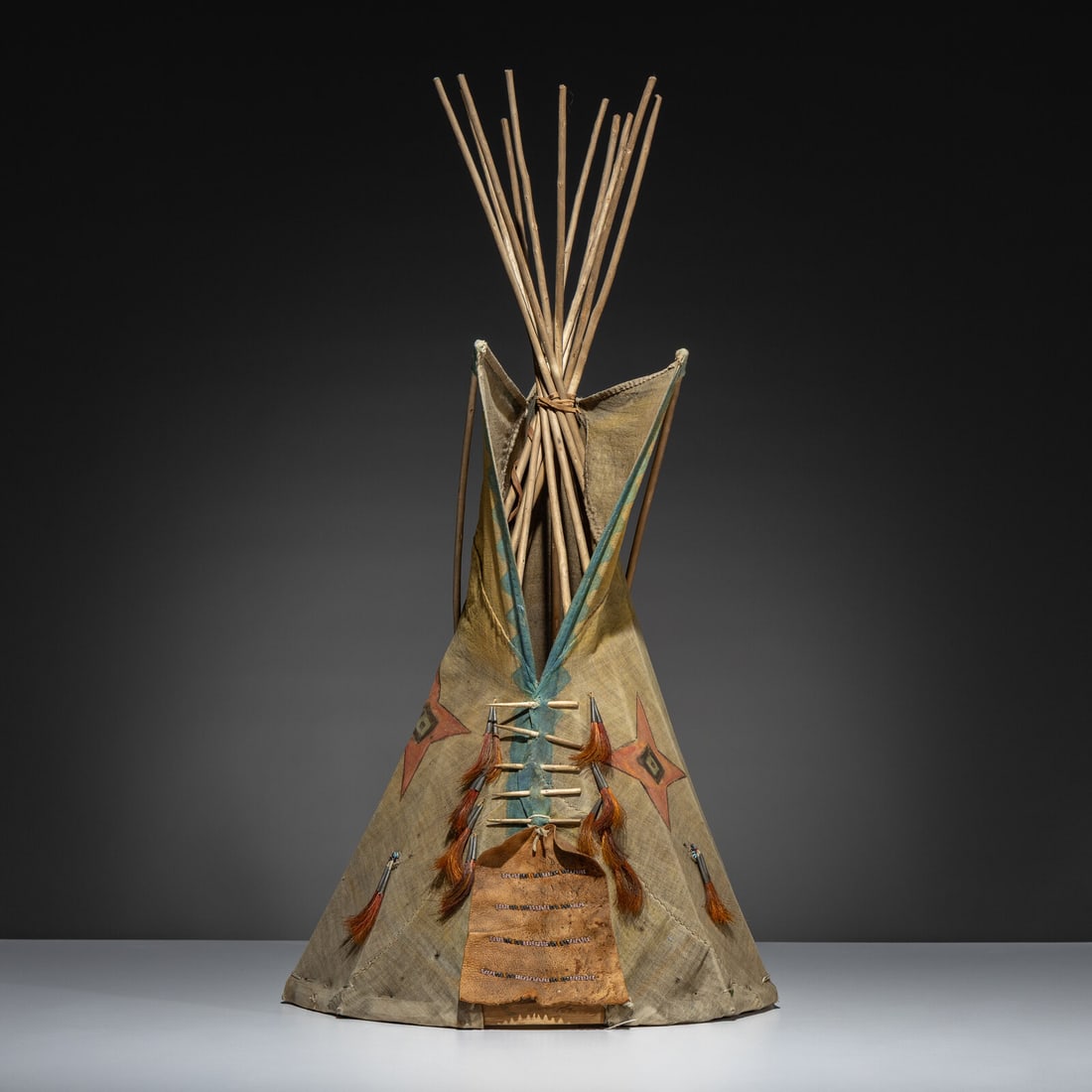 Plains Painted Model Tipi: Plains Painted Model Tipi early 20th century linen; stars painted in yellow, orange, and black; horsehair-filled tin cones; wood framework height 30 inches x diameter 16 inches From an Old Hollywood