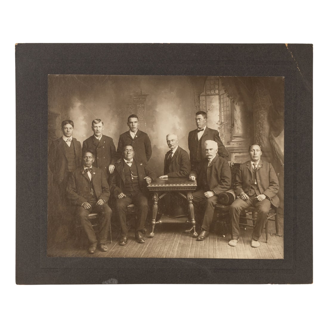 David F. Barry (1854-1934) Studio portrait of Major James McLaughlin and Native American Subjects: David F. Barry (1854-1934) Studio portrait of Major James McLaughlin and Native American Subjects 7 3/8 x 9 1/2 in. photograph on 9 3/4 x 12 1/4 in. cardstock mount. A portrait of nine men posed toget