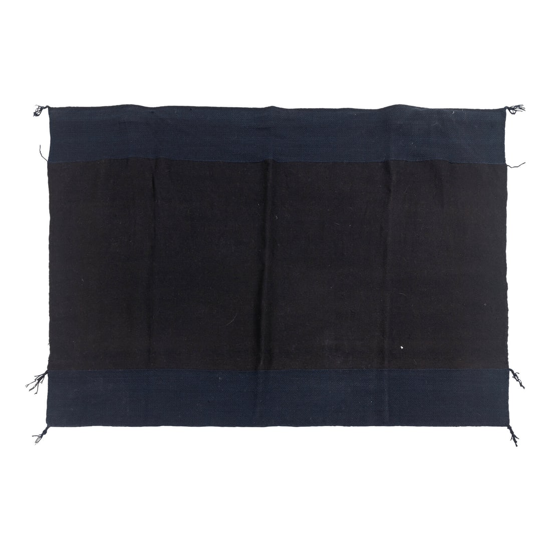 Hopi Woman's Manta: Hopi Woman's Manta fourth quarter 19th century woven in indigo and black yarn; outer bands with a small diamond pattern, central field woven on the diagonal 38 x 52 inches This lot is located in