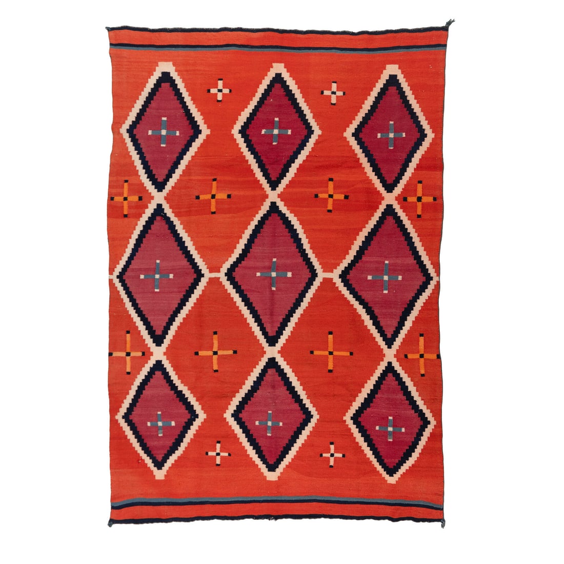 Navajo Transitional Late Classic Serape [Rug]: Navajo Transitional Late Classic Serape [Rug] late 19th century handspun wool woven with colors of two shades of red, orange, indigo, light blue, and cream; overall diamond pattern with crosses 76 x