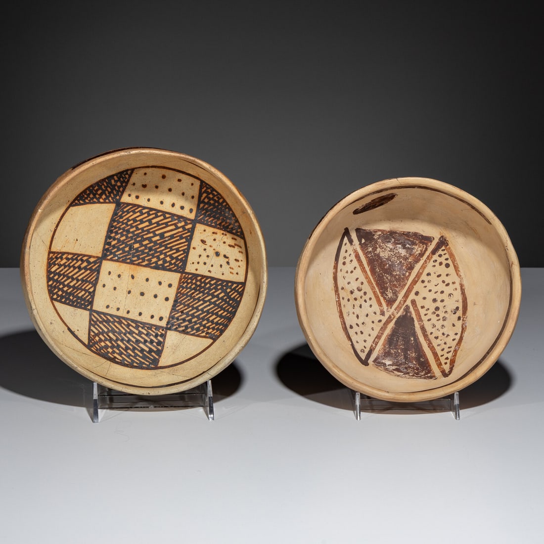 Ancestral Pueblo, Jeddito Black-on-Yellow Pottery Bowls, with Geometric Designs: Ancestral Pueblo, Jeddito Black-on-Yellow Pottery Bowls, with Geometric Designs A.D. 1325-1600 lot of 2, sizes include: checkered pattern height 3 inches x diameter 8 inches double-hourglass pattern h