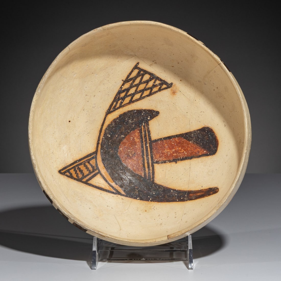 Ancestral Pueblo, Sikyatki Polychrome Pottery Bowl, with Abstract Parrot: Ancestral Pueblo, Sikyatki Polychrome Pottery Bowl, with Abstract Parrot ca 1375-1625 height 3-1/2 inches x diameter 8-3/4 inches From an Old Hollywood Family This lot is located in Chicago. Ex Tony B