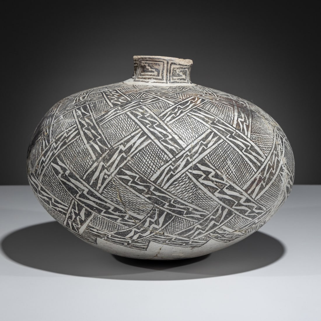 Large Ancestral Pueblo, Tularosa Black-on-White Pottery Olla: Large Ancestral Pueblo, Tularosa Black-on-White Pottery Olla A.D. 1150-1325 designed with an intriguing three-dimensional effect created by interlaced bands and fine lines height 10 inches x