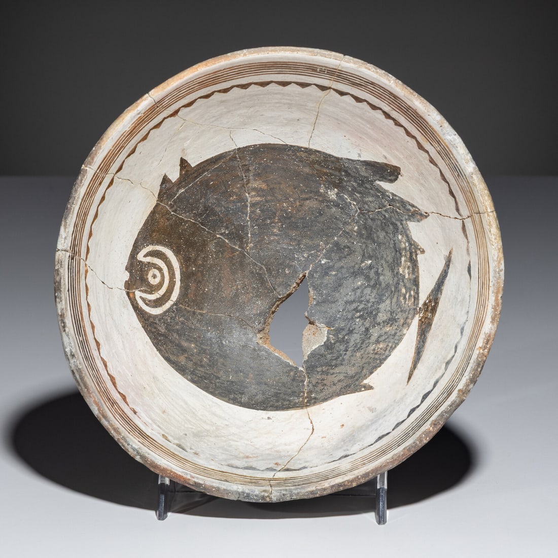 Ancestral Pueblo, Mimbres Classic Black-on-White Pottery Bowl, with Fish: Ancestral Pueblo, Mimbres Classic Black-on-White Pottery Bowl, with Fish A.D. 1000-1140 height 3 inches x diameter 6-1/2 inches From an Old Hollywood Family This lot is located in Chicago. Ex Tony