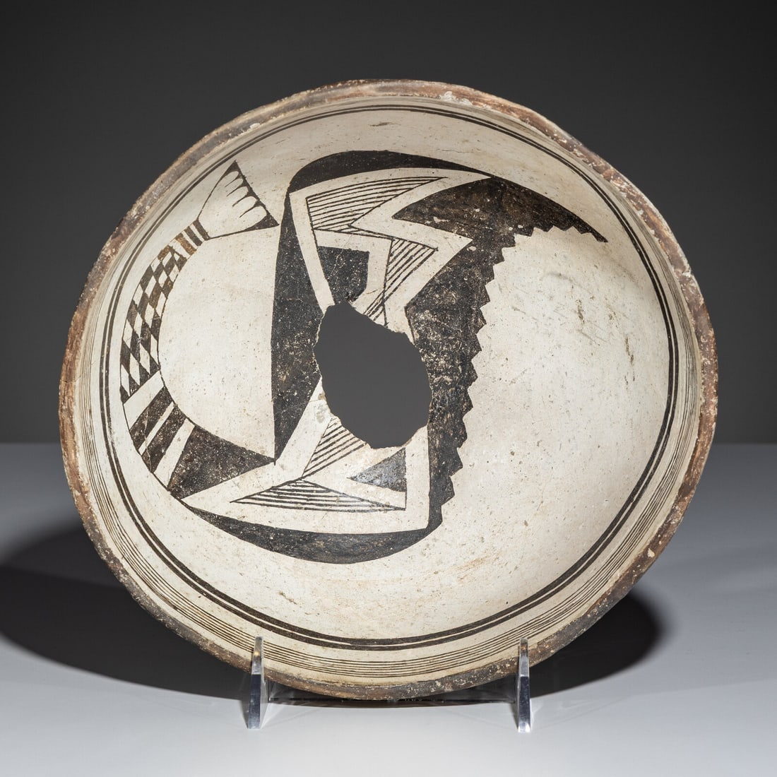 Ancestral Pueblo, Mimbres Black-on-White Pottery Bowl, Transformational Fish: Ancestral Pueblo, Mimbres Black-on-White Pottery Bowl, Transformational Fish A.D. 1000-1140 height 4 inches x diameter 9 inches From an Old Hollywood Family This lot is located in Chicago. Ex Tony