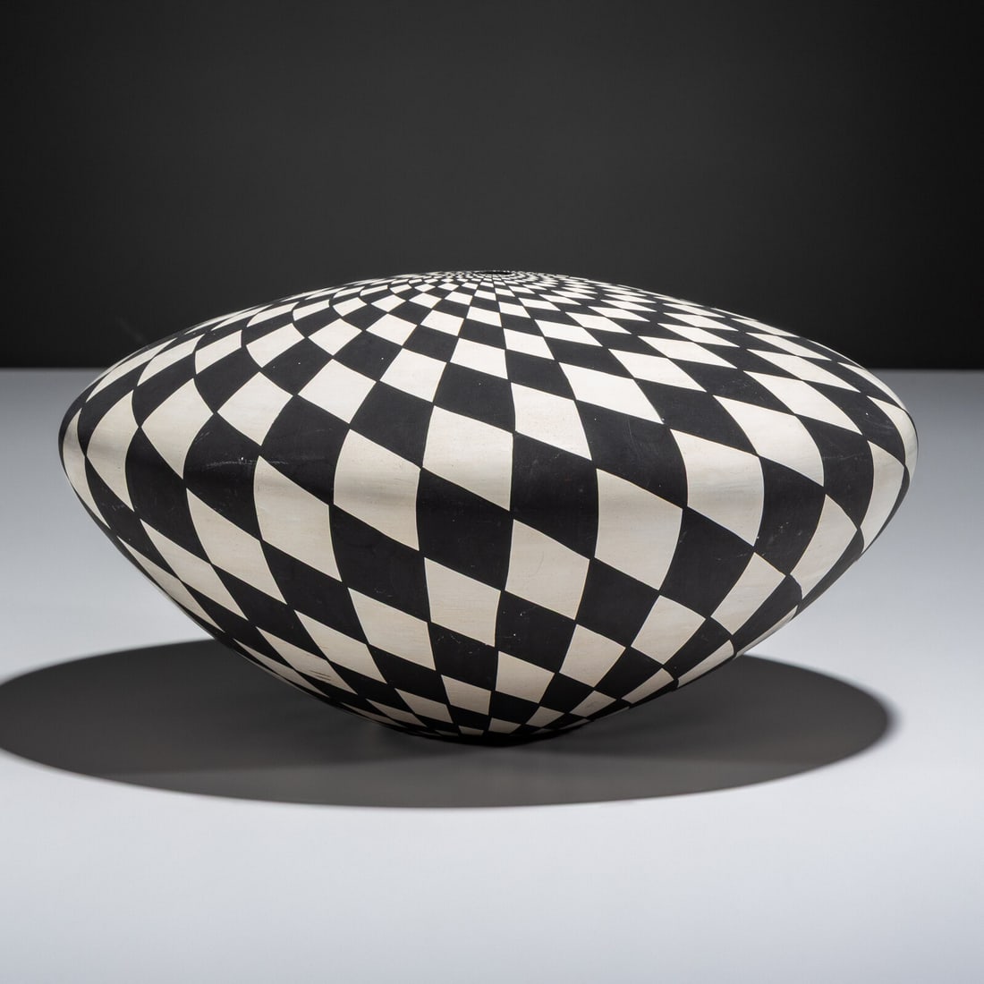 Dorothy Torivio (Acoma, 1946-2011) Pottery Jar, Op-Art Design: Dorothy Torivio (Acoma, 1946-2011) Pottery Jar, Op-Art Design signed on base height 5 inches x diameter 9-1/2 inches Property from the Collection of Dr. Deane and Susan Penn This lot is located in