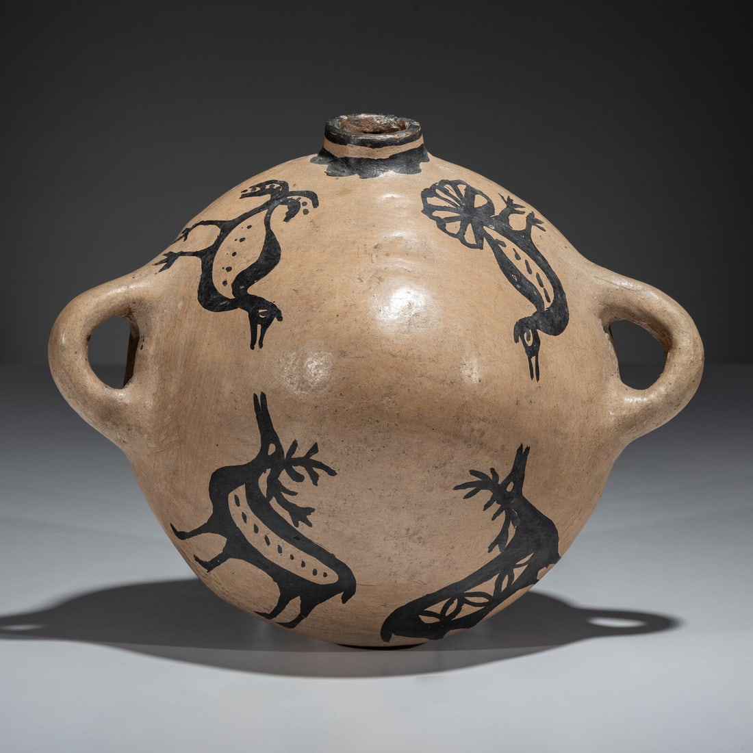 Cochiti Figural Pottery Canteen: Cochiti Figural Pottery Canteen early 20th century decorated with two elk and two birds length 9 inches x width 10-1/2 inches x depth 5-1/2 inches This lot is located in Chicago.
