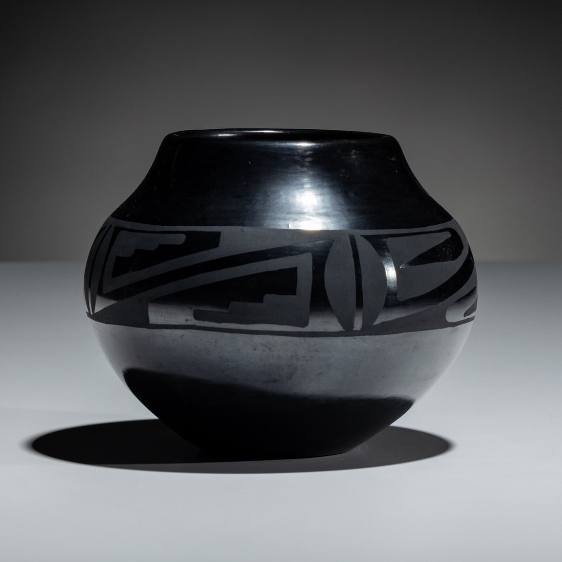 Maria and Santana Martinez (San Ildefonso, 1887-1980 / 1909-2002) Blackware Pottery Jar, Gunmetal: Maria and Santana Martinez (San Ildefonso, 1887-1980 / 1909-2002) Blackware Pottery Jar, Gunmetal Finish winged elements around the shoulder; signed on base height 4-3/4 inches x diameter 6 inches
