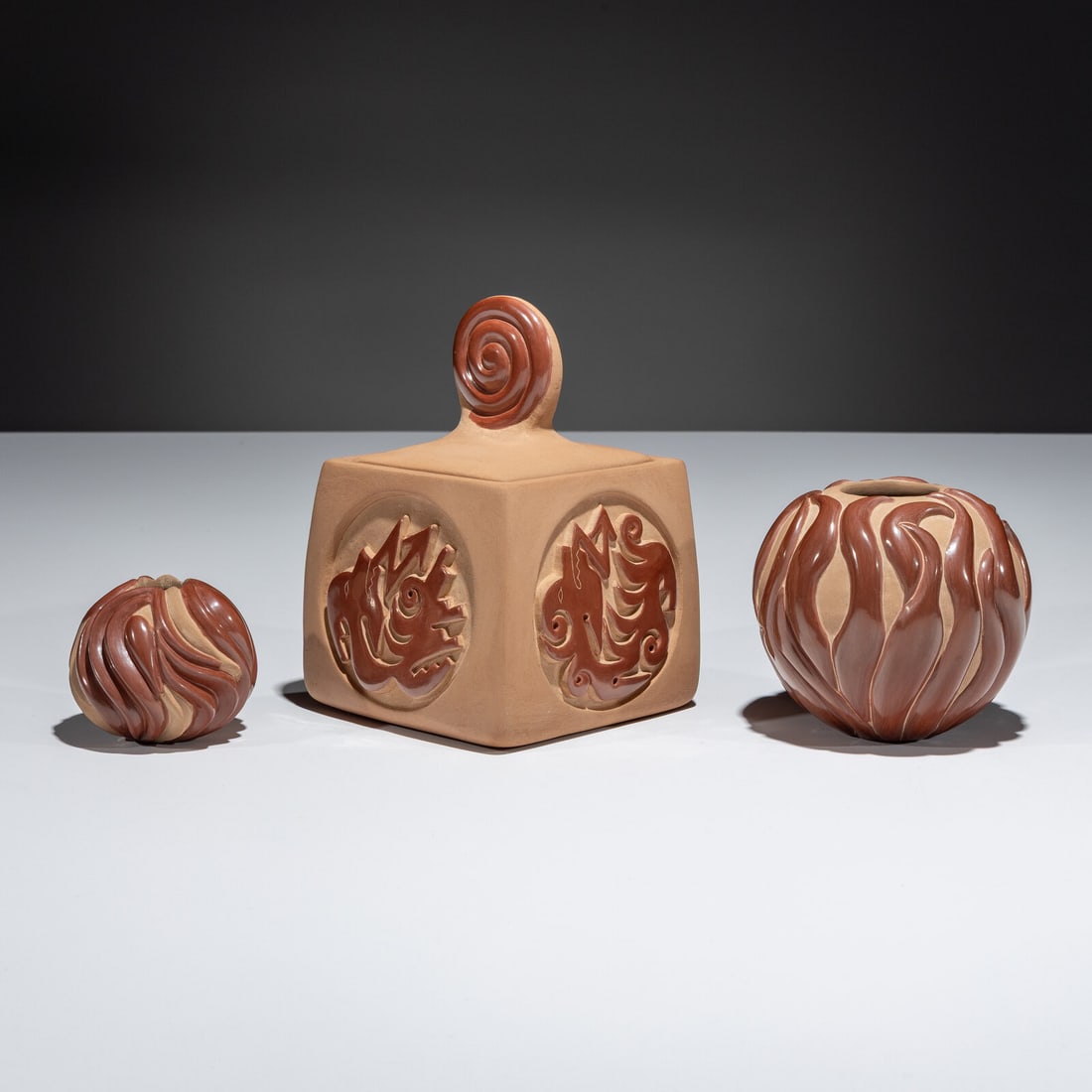 Nancy Youngblood AND Chris Youngblood (Santa Clara, b. 1955 / b. 1989) Carved Red and Tan Pottery: Nancy Youngblood AND Chris Youngblood (Santa Clara, b. 1955 / b. 1989) Carved Red and Tan Pottery lot of 3, includes: a small jar by Nancy Youngblood, height 2-1/4 inches x diameter 2-1/4 inches a lar