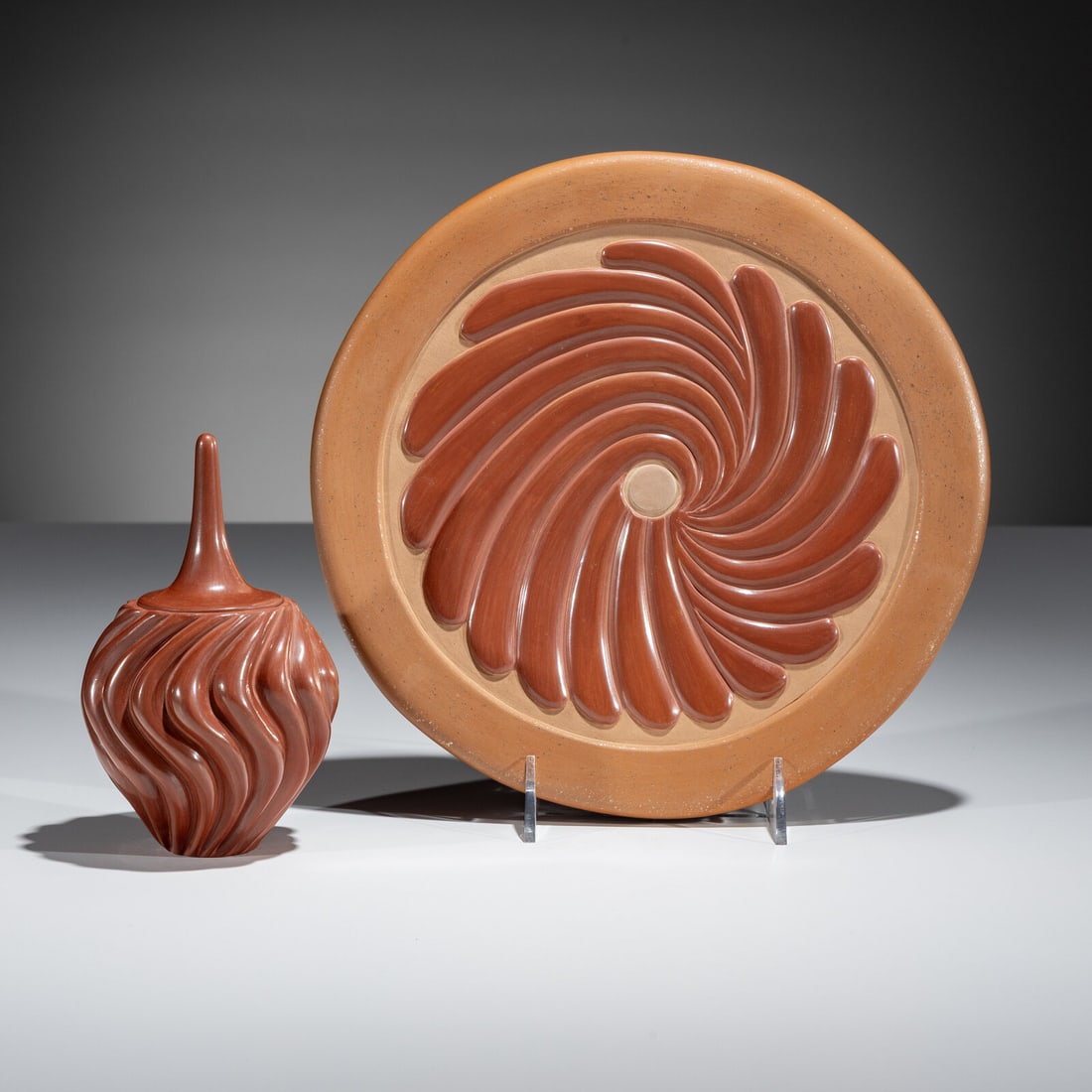Chris Youngblood (Santa Clara, b. 1989) Carved Redware Pottery Plate and Vase: Chris Youngblood (Santa Clara, b. 1989) Carved Redware Pottery Plate and Vase lot of 2, includes: a red and tan plate with a central swirling design and micaceous border; signed on base, diameter 10 i