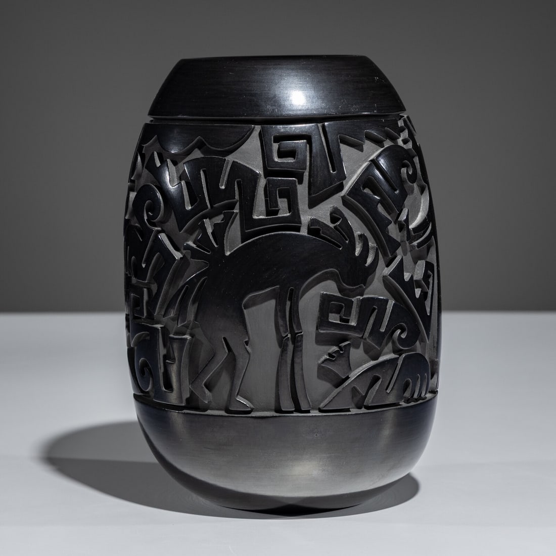 Tammy Garcia (Santa Clara, b. 1969) Carved Figural Blackware Pottery VaseNovember 1994: Tammy Garcia (Santa Clara, b. 1969) Carved Figural Blackware Pottery VaseNovember 1994 signed and dated on base height 9 inches x diameter 6-1/2 inches This lot is located in Chicago. Purchased from A