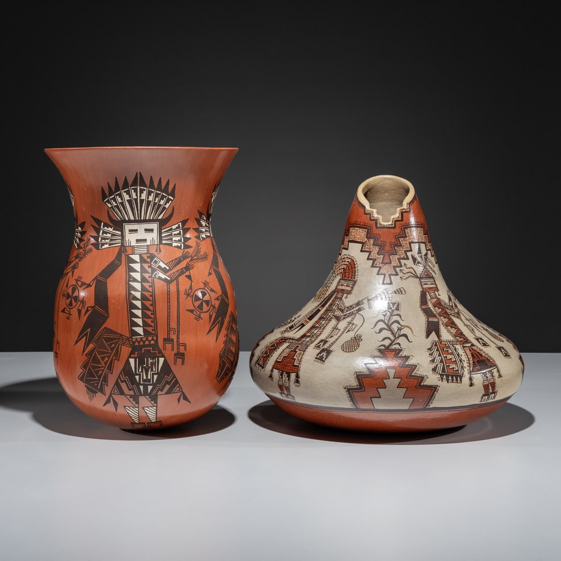 Lucy Lueppe McKelvey (Diné, b. 1950) Pottery Vases: Lucy Lueppe McKelvey (Diné, b. 1950) Pottery Vases lot of 2, both signed and titled near the base, includes: Long Hairs of the Mt. Way Chant vase with flared rim and painted with four Yeibichai f