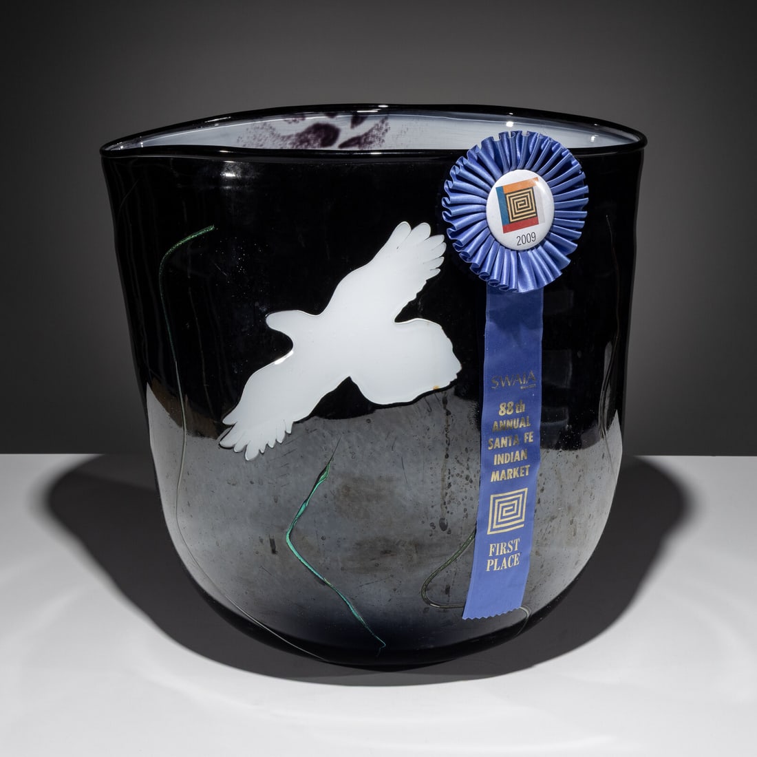 Marvin Oliver (Quinault-Isleta, 1946-2019) Among the Clouds Raven Gathers in His Basket: Marvin Oliver (Quinault-Isleta, 1946-2019) Among the Clouds Raven Gathers in His Basket blown glass sculpture signed on base height 16 inches x diameter 16 inches Property from the Collection of