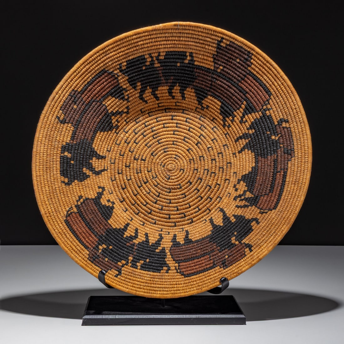Carol Emarthle Douglas (Seminole-Northern Arapaho, 20th century) Basket, with Buffalo: Carol Emarthle Douglas (Seminole-Northern Arapaho, 20th century) Basket, with Buffalo designed with a herd of buffalo and buffalo tracks height 3-3/4 inches x diameter 14 inches Property from the Coll