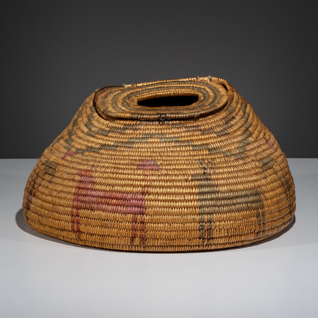 Early Jicarilla Apache Pictorial Creel: Early Jicarilla Apache Pictorial Creel early 20th century painted in red and green, depicting a male and female deer height 9-1/4 inches x length 18 x width 11 inches From an Old Hollywood Family This