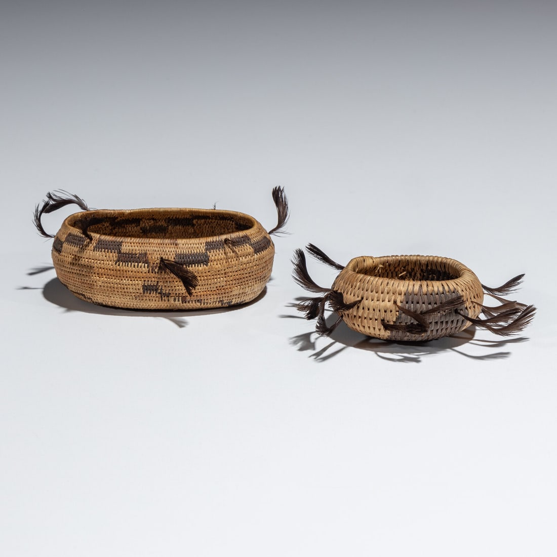 Pomo Miniature Gift Baskets: Pomo Miniature Gift Baskets early 20th century lot of 2, sizes include: height 1 inch x diameter 4 inches AND height 1/2 inch x diameter 2-1/2 inches