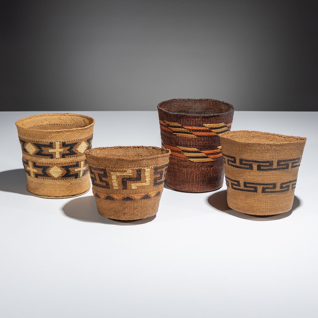 Tlingit Polychrome Berry Baskets: Tlingit Polychrome Berry Baskets first half 20th century lot of 4, each with false embroidered designs height 6 inches x diameter 5-1/2 inches; height 5-1/4 inches x diameter 5-1/2 inches; height
