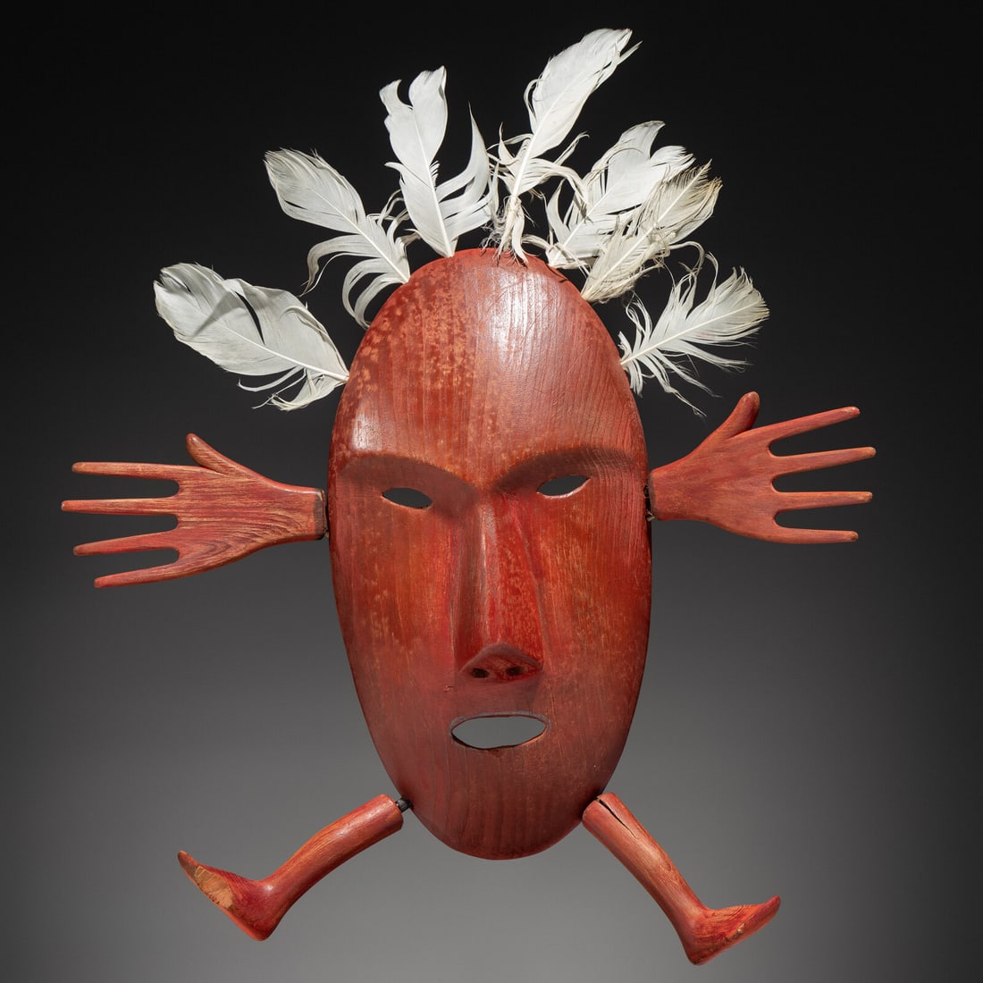 Yup'ik Dance Mask: Yup'ik Dance Mask early 20th century Kuskokwim River Area, Alaska; appendages set with baleen pegs; red pigment; twisted hide thong overall length 17 inches x width 14-1/2 inches Ex Jeffery Myers