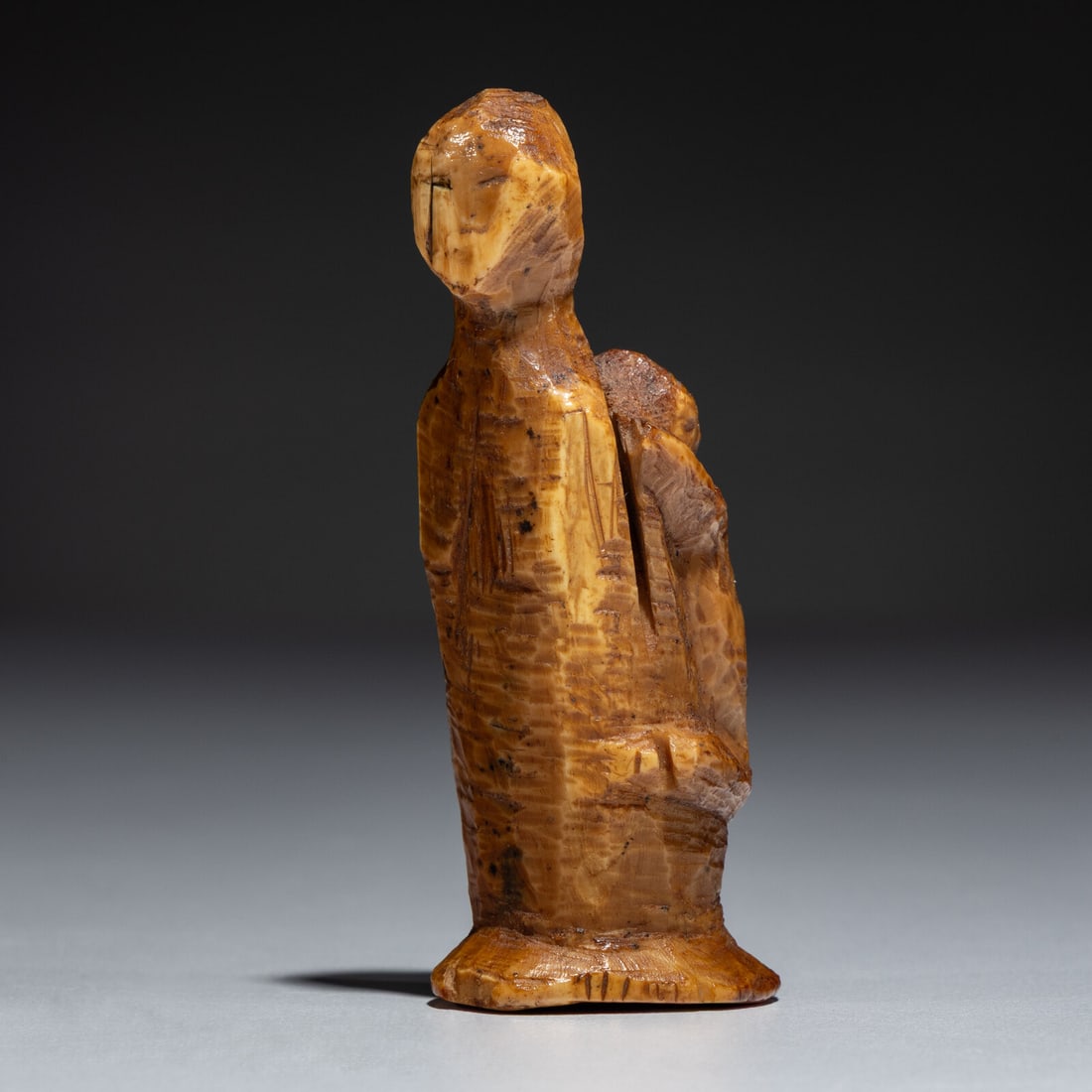 St. Lawrence Island Thule Culture, Mother and Child Figure: St. Lawrence Island Thule Culture, Mother and Child Figure pre-1600 mother with a softly sculpted face, carrying her baby on her back height 3-1/4 inches Ex Jeffery Myers Collection This lot is