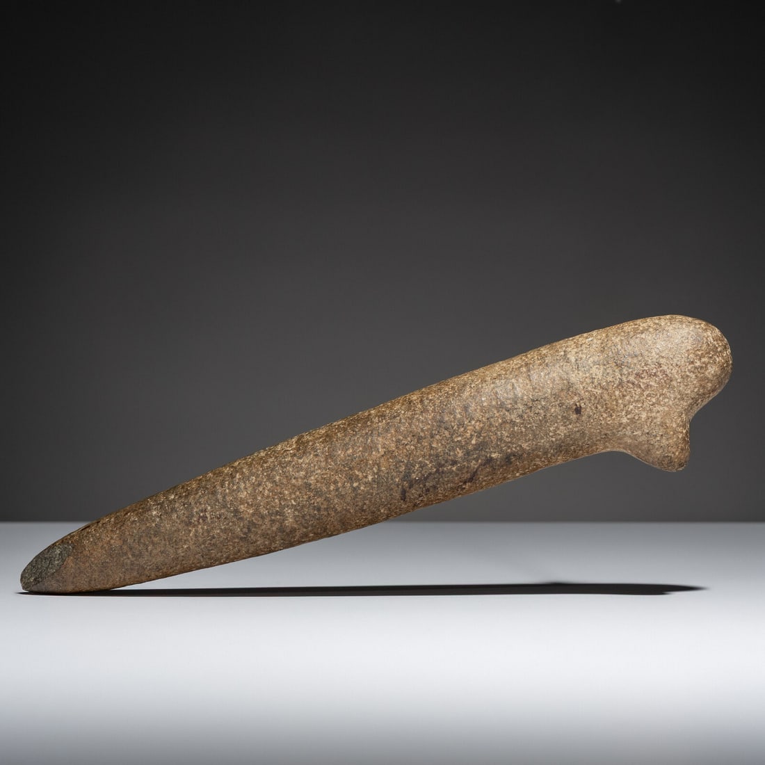 Columbia River Basalt Club, Slave Killer: Columbia River Basalt Club, Slave Killer pre-1500 carved with a small protrusion on one end, tapering to a point on the opposite end length 12 inches Weapons [such as this example] were mainly