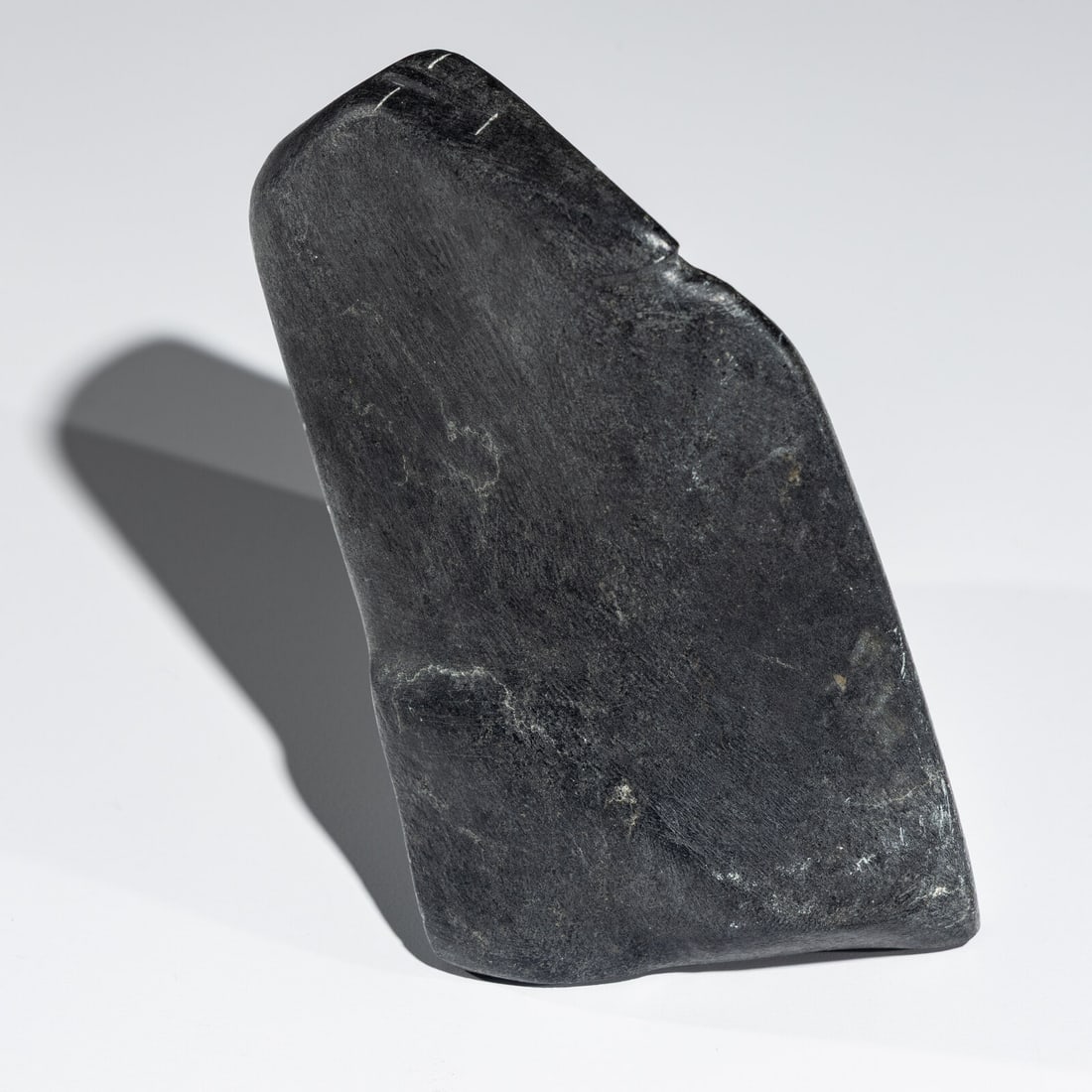 John Pangnark (Inuit [Arviat], 1920-1980) Man ca 1965: John Pangnark (Inuit [Arviat], 1920-1980) Man ca 1965 steatite signed in syllabics height 5-1/2 inches x width 4-1/2 inches x depth 5-3/4 inches Property from the Serr and Shannon Collection,