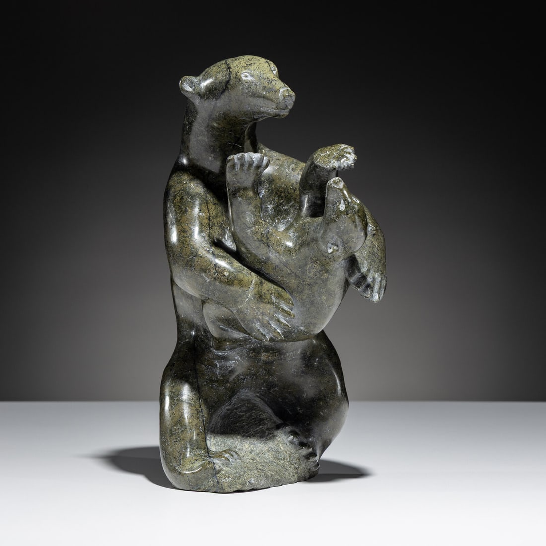 Henry Evaluardjuk (Inuit [Kinngait], 1923-2007) Mother Bear and Cub: Henry Evaluardjuk (Inuit [Kinngait], 1923-2007) Mother Bear and Cub serpentine signed in Roman and syllabics height 11-1/2 inches x width 6 inches This lot is located in Chicago. Purchased from